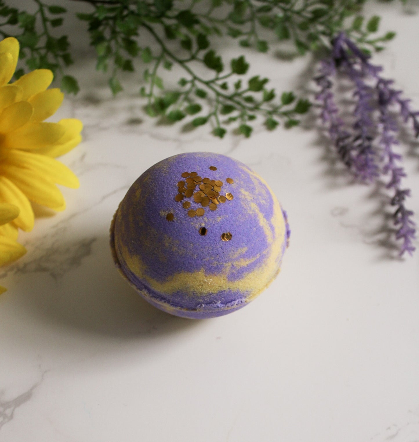 Lavender Soleil Bath Bomb, yellow and purple with gold biodegradable glitter on top