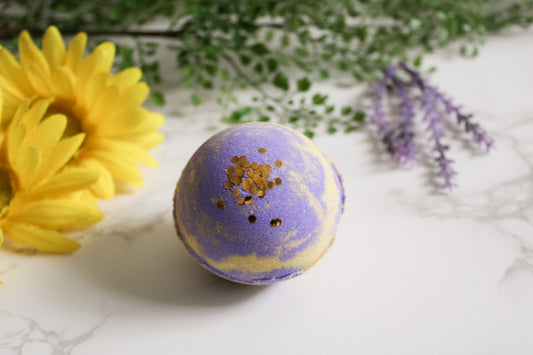 Lavender Soleil Bath Bomb, yellow and purple with gold biodegradable glitter on top